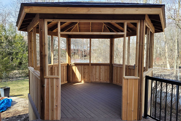 Backyard gazebo off of deck